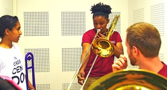 BPYO Trombonist Robyn Smith works with In Crescendo students